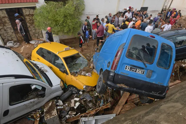 Cars are piled up in a street after being swept away by torrential rains in the city of Mhamdia near the Tunisian capital Tunis on October 18, 2018. Flash flooding in Tunisia has killed at least five people while a further two are unaccounted for, the interior ministry said today. (Photo by Fethi Belaid/AFP Photo)