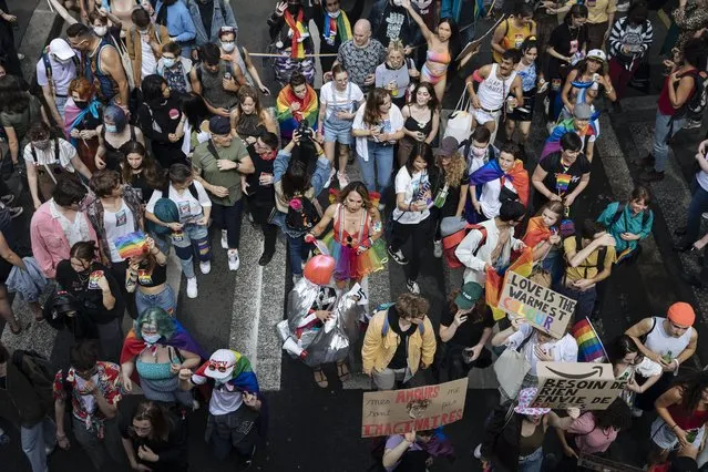Participants dance during the annual Gay Pride march in Paris, Saturday, June 26, 2021. (Photo by Lewis Joly/AP Photo)