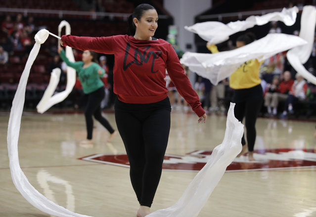 Dancers from the group Love Never Fails, some of which include human trafficking survivors, perform during halftime of an NCAA college basketball game between Washington State and Stanford, Sunday, January 20, 2019, in Stanford, Calif. Stanford held the school's first Human Trafficking Awareness Game which included dancers from the non-profit Love Never Fails, which works to restore, educate and protect those at risk of domestic human trafficking. (Photo by Ben Margot/AP Photo)