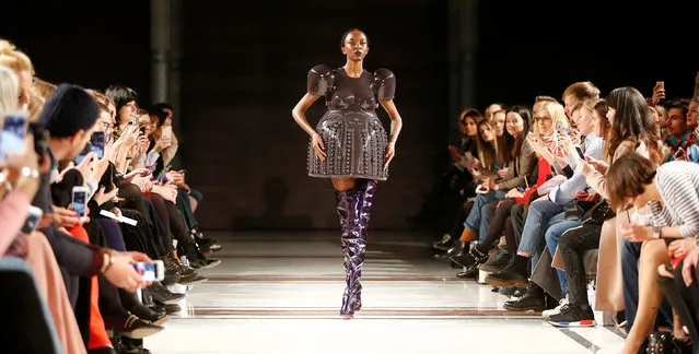 A model presents a creation by Marina Hoermanseder on the sidelines of the Berlin Fashion Week Autumn/Winter 2017/2018 in Berlin, Germany January 19, 2017. (Photo by Hannibal Hanschke/Reuters)