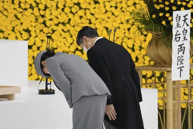Japan's Emperor Naruhito, right, and Empress Masako bow during a ceremony to mark the 76th anniversary of Japan's surrender in World War II at Budokan hall in Tokyo Sunday, August 15, 2021. (Photo by Toru Hanai/Pool Photo via AP Photo)