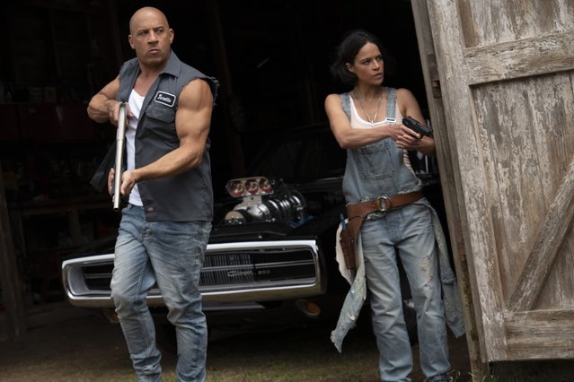 This image released by Universal Pictures shows Vin Diesel, left, and Michelle Rodriguez in a scene from “F9: The Fast Saga”. (Photo by Giles Keyte/Universal Pictures via AP Photo)