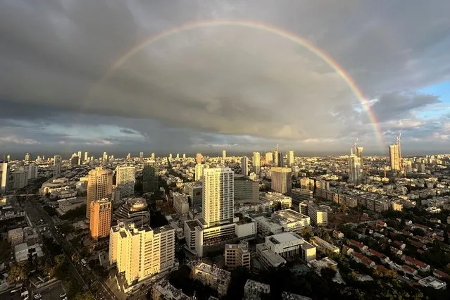 A rainbow appears in the sky on a rainy day in Tel Aviv, Israel on January 3, 2024. (Photo by Aleksandra Michalska/Reuters)