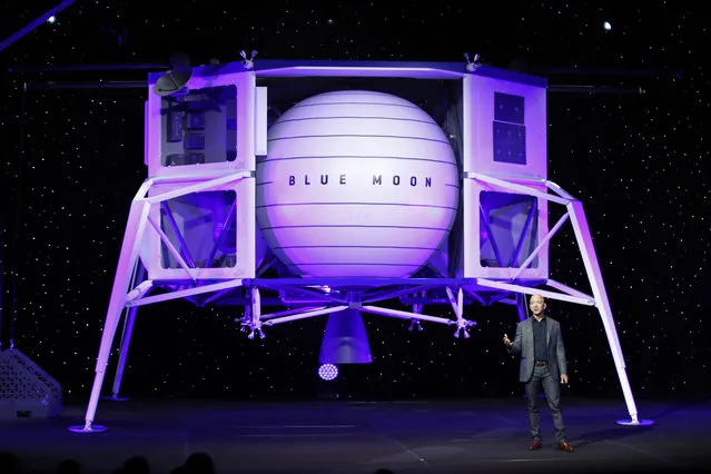 Jeff Bezos speaks in front of a model of Blue Origin's Blue Moon lunar lander, Thursday, May 9, 2019, in Washington. (Photo by Patrick Semansky/AP Photo)