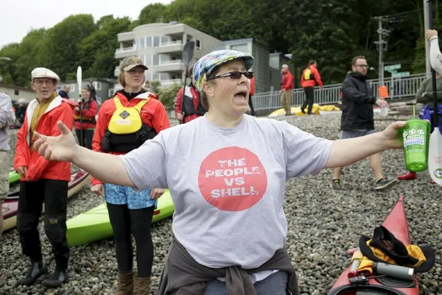 Kristen Reid of Seattle organizes activists as they prepare to protest the Shell Oil Company's drilling rig Polar Pioneer which is parked at Terminal 5 at the Port of Seattle, Washington May 16, 2015. (Photo by Jason Redmond/Reuters)