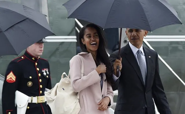 Malia Obama walks off of Marine One with her father President Barack Obama as they head to Air Force One at Andrews Air Force Base in Md., Thursday, April 7, 2016. The Obama's are traveling to Chicago where President  Obama will speak at the University of Chicago Law School. (Photo by Susan Walsh/AP Photo)