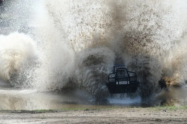 A participant attends a regional tractor racing competition Bizon-Track-Show outside of Rostov-on-Don, Russia on June 2, 2019. (Photo by Sergey Pivovarov/Reuters)