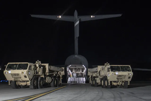 In this photo provided by U.S. Forces Korea, trucks carrying U.S. missile launchers and other equipment needed to set up the Terminal High Altitude Area Defense (THAAD) missile defense system arrive at the Osan air base in Pyeongtaek, South Korea, Monday, March 6, 2017. The U.S. military has begun moving equipment for the controversial missile defense system to ally South Korea. The announcement Tuesday by the U.S. military comes a day after North Korea test-launched four ballistic missiles into the ocean near Japan. (Photo by U.S. Force Korea via AP Photo)