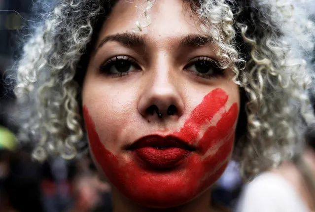 A demonstrator takes part in a march on International Women's Day in Sao Paulo, Brazil, March 8, 2017. (Photo by Nacho Doce/Reuters)