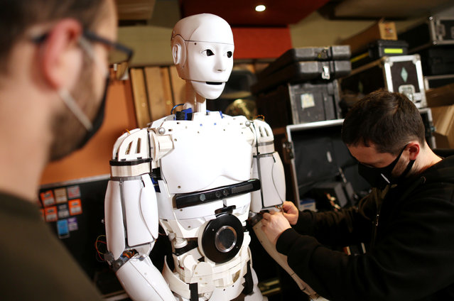 Almir Besic (L), former student of the Electrical Engineering Faculty and Vedran Mujagic, member of rock group “Dubioza Kolektiv” fix humanoid robot called “Robby Megabyte” in Sarajevo, Bosnia and Herzegovina on February 3, 2021. (Photo by Dado Ruvic/Reuters)