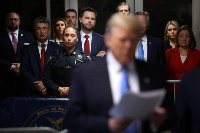 Senator J.D. Vance (R-OH) looks on as Donald Trump speaks to the media at his trial for allegedly covering up hush money payments at Manhattan Criminal Court in New York City on May 13, 2024. (Photo by Spencer Platt/Pool via Reuters)