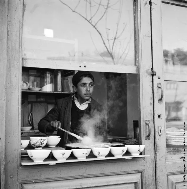 1952:  A street stall in Teheran selling bowls of steaming soup