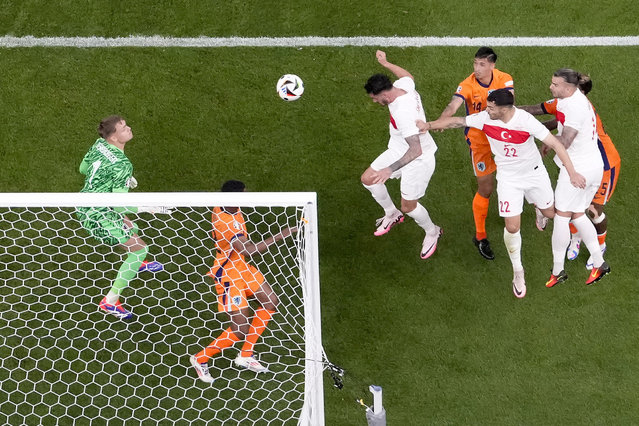 Turkey's Samet Akaydin, third left, scores the opening goal during a quarterfinal match between the Netherlands and Turkey at the Euro 2024 soccer tournament in Berlin, Germany, Saturday, July 6, 2024. (Phoot by Markus Schreiber/AP Photo)