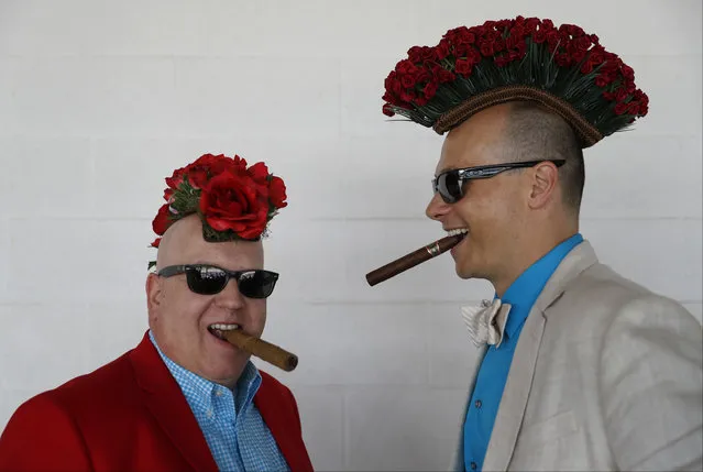 Fans smoke cigars before the 143rd running of the Kentucky Derby horse race at Churchill Downs Saturday, May 6, 2017, in Louisville, Ky. (Photo by John Minchillo/AP Photo)