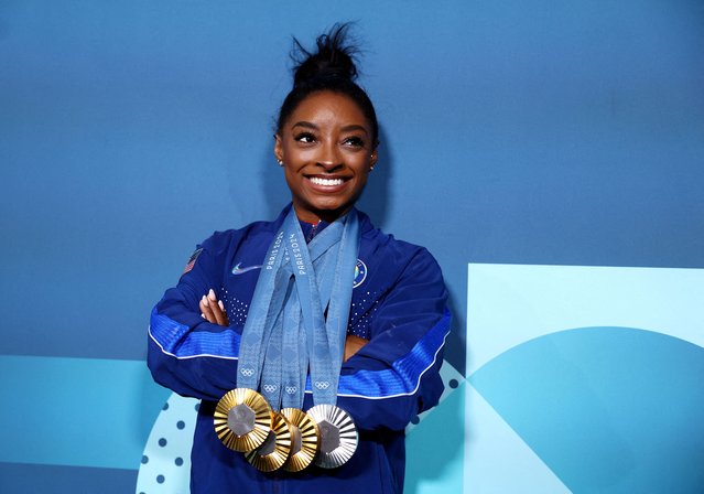 Simone Biles of Team United States poses with her Paris 2024 Olympic medals following the Artistic Gymnastics Women's Floor Exercise Final on day ten of the Olympic Games Paris 2024 at Bercy Arena on August 05, 2024 in Paris, France. (Photo by Hannah Mckay/Reuters)