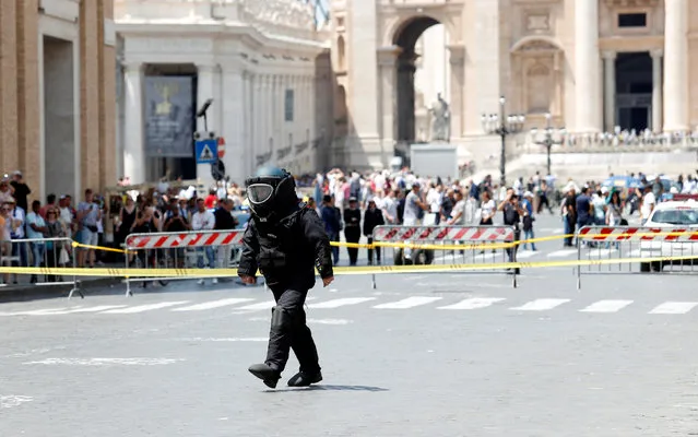 A police officer from the bomb disposal unit checks the area after an alarm near the Vatican, in Rome, Italy, May 23, 2017. (Photo by Remo Casilli/Reuters)
