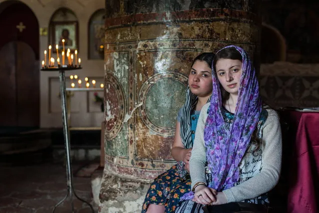 “Young girls in Alaverdi Cathedral”. On a Sunday morning Alaverdi cathedral in Georgia is full of worshipers. Also young people go to church in this very religious (orthodox) country. Photo location: Alaverdi, Georgia. (Photo and caption by Corneliu Cazacu/National Geographic Photo Contest)