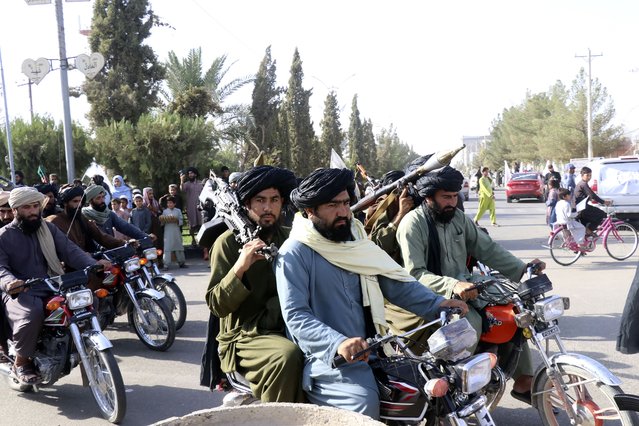 Taliban fighters celebrate the third anniversary of the withdrawal of US-led troops from Afghanistan, in Lashkar Gah, Helmand province, southwestern Afghanistan, Wednesday, August 14, 2024. (Photo by Abdul Khaliq/AP Photo)