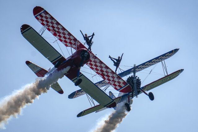 Wingwalkers from the AeroSuperBatics display team entertain the crowds on the first day of the Midlands Air Festival on June 02, 2023 in Alcester, England. The Midlands Air Festival returns for its fifth year, featuring displays by the Royal Air Force’s Aerobatic team, the Red Arrows, performing their first displays of the air show season, and the Typhoon, the RAF's frontline fighter jet. (Photo by Christopher Furlong/Getty Images)