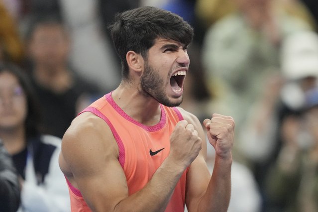 Carlos Alcaraz of Spain reacts after winning against Jannik Sinner of Italy during their men's singles finals match of the China Open tennis tournament, at the National Tennis Center in Beijing, Wednesday, October 2, 2024. (Photo by Achmad Ibrahim/AP Photo)