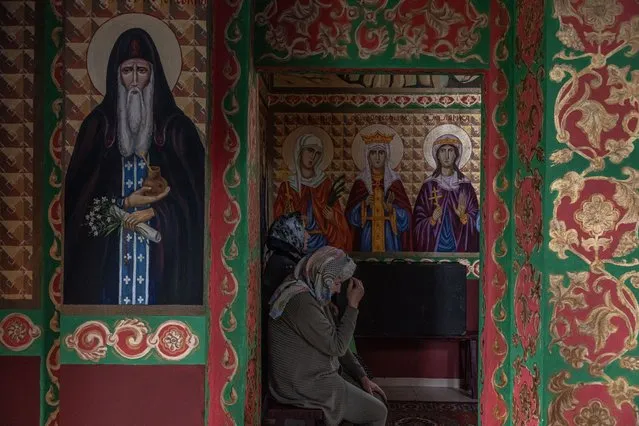 Women attend a morning service at a church in Moshchun, Kyiv Oblast, Ukraine, 12 July 2022. Towns and villages located in the northern Kyiv region witnessed heavy shelling and fighting when Russian troops tried to reach the Ukrainian capital between February and March 2022. (Photo by Roman Pilipey/EPA/EFE/Rex Features/Shutterstock)