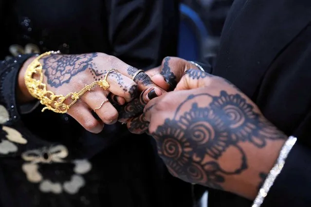 A Muslim woman shows her henna done in celebration of the Eid al-Adha festival, in Louisville, Kentucky, U.S., July 9, 2022. (Photo by Amira Karaoud/Reuters)