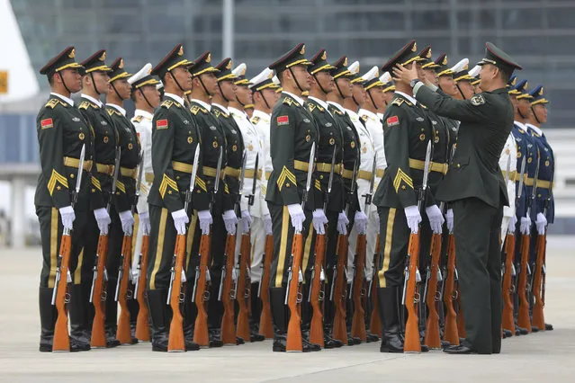 Chinese People's Liberation Army honor guard prepare for the arrival of Brazilian President Michel Temer at Xiamen Gaoqi International Airport to attend the upcoming BRICS Summit in Xiamen, China's Fujian province, Sunday, September 3, 2017. President Temer is visiting China as his country seeks investments to shore up its flagging economy. (Photo by Wu Hong/Pool Photo via AP Photo)