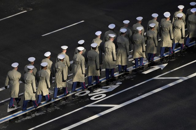 Members of the U.S. Navy line up to march with the casket of former President Jimmy Carter before it arrives at the U.S. Navy Memorial to travel to the Capitol in Washington to lie in state, Tuesday, Jan. 7, 2025. Carter died Dec. 29 at the age of 100. (Photo by Mark Schiefelbein, Pool via AP Photo)