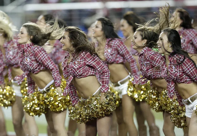 San Francisco 49ers cheerleaders perform during the second half of an NFL football game against the Chicago Bears in Santa Clara, Calif., Sunday, September 14, 2014. (Photo by Marcio Jose Sanchez/AP Photo)