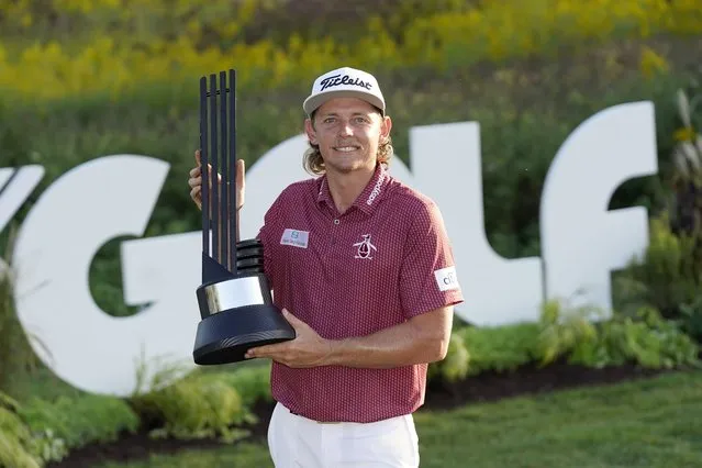 Cameron Smith poses with the champion's trophy after winning the LIV Golf Invitational-Chicago tournament Sunday, September 18, 2022, in Sugar Hill, Ill. (Photo by Charles Rex Arbogast/AP Photo)