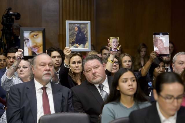 People hold up photos during a Senate Judiciary committee hearing on fentanyl, and the need for permanent class scheduling, on Capitol Hill, Tuesday, February 4, 2025, in Washington. (Photo by Rod Lamkey, Jr./AP Photo)