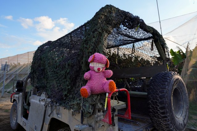 A stuffed animal with a blindfold hangs on the back of an Israeli military vehicle near the Israel-Gaza border, amid the ongoing conflict between Israel and the Palestinian Islamist group Hamas, in Israel, on January 26, 2024. (Photo by Alexandre Meneghini/Reuters)