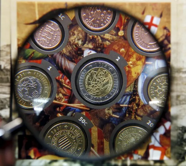 Euro commemorative coins of the “Catalan Republic” are seen through a magnifying glass in a philately and numismatics shop in Barcelona, Spain, September 17, 2015. Hundreds of thousands of people packed the streets of Barcelona on September 11 to call for Catalonia to break away from Spain, two weeks before a September 27 regional election that many see as a “make-or-break” moment for the independence movement. (Photo by Albert Gea/Reuters)