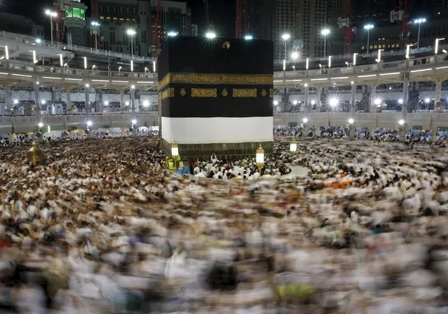 Muslim pilgrims pray around the holy Kaaba at the Grand Mosque ahead of the annual haj pilgrimage in Mecca September 22, 2015. (Photo by Ahmad Masood/Reuters)