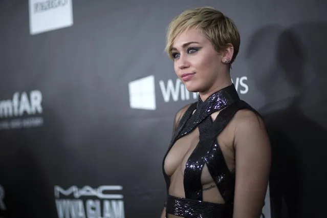 Singer Miley Cyrus poses at the amfAR's Fifth Annual Inspiration Gala in Los Angeles, California October 29, 2014. (Photo by Mario Anzuoni/Reuters)