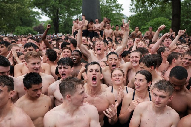 U.S. Naval Academy freshman (“plebes”) celebrate after placing the hat on the annual Herndon Monument climb at the U.S. Naval Academy on May 14, 2025 in Annapolis, Maryland. In the annual tradition, the plebes attempt to scale the 21-foot greased monument to knock off a “dixie cup” hat and replace it with an upperclassman's hat. The 2028 midshipmen's class took 2 hours 27 minutes and 31 seconds to scale the monument and replace the hat. (Photo by Kayla Bartkowski/Getty Images)