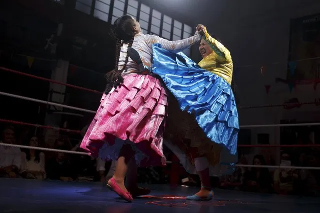 Bolivian wrestlers Yenny Mamani (R), nicknamed Martha "La Altena" and Leonor Cordova, nicknamed Angela "La Simpatica", battle during a wrestling bout in Madrid, Spain, October 8, 2015. (Photo by Juan Medina/Reuters)