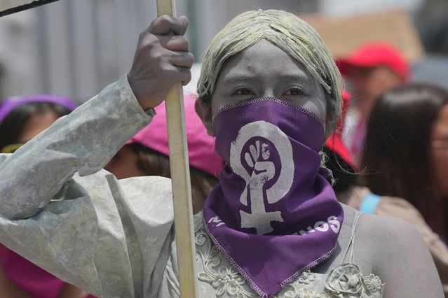 A woman takes part in an International Women's Day march in Quito, Ecuador, Saturday, March 8, 2025. (Photo by Dolores Ochoa/AP Photo)