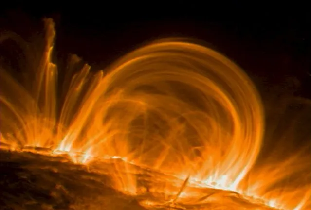 Giant fountains of fast-moving, multimillion-degree gas in the outermost atmosphere of the Sun have revealed an important clue to a long-standing mystery - the location of the heating mechanism that makes the corona about 300 times hotter than the Sun's visible surface in this September 26, 2000 file photo. (Photo by Reuters/NASA)