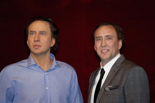Nicolas Cage stands next to his figure at the Grevin wax museum during the presentation of his waxwork in Paris, January 29, 2012. (Photo by Gonzalo Fuentes/Reuters)