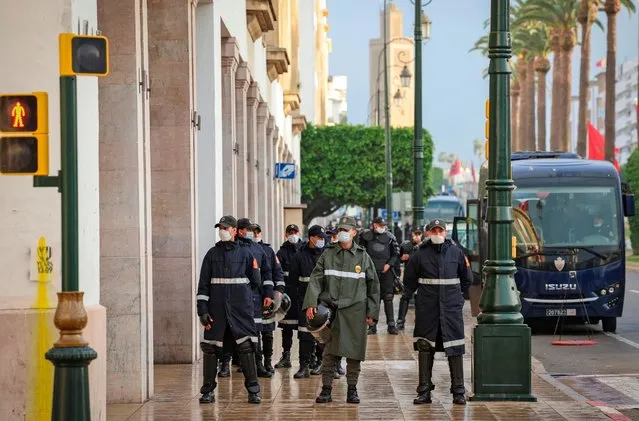 Security forces block an avenue in front of the parliament building to stop a demonstration against normalising relations with Israel, in the Moroccan capital Rabat on December 14, 2020. Morocco announced a “resumption of relations” with Israel, shortly after US President Donald Trump tweeted that Rabat and the Jewish state had “agreed to full diplomatic relations”. (Photo by Fadel Senna/AFP Photo)
