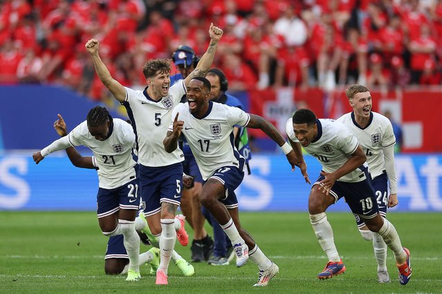 (Frm L) England's forward #21 Eberechi Eze, England's defender #05 John Stones, England's forward #17 Ivan Toney, England's midfielder #10 Jude Bellingham and England's midfielder #24 Cole Palmer celebrate at the end of the penalty shootout as they win the UEFA Euro 2024 quarter-final football match between England and Switzerland at the Duesseldorf Arena in Duesseldorf on July 6, 2024. (Photo by Adrian Dennis/AFP Photo)