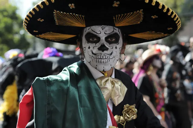 Participants take part in a festival inspired by the film Spectre, to celebrate the Day of the Dead in Mexico City, Mexico on October 29, 2016. (Photo by Carlos Tischler/Rex Features/Shutterstock)