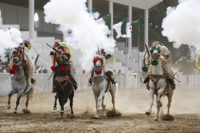 An equestrian festival held on the 62nd anniversary of the independence war against French colonialism in Algiers, Algeria on July 06, 2024. In the festival, which symbolizes the resistance of Algerians against the colonizers, riders carrying rifles performed on horseback. (Photo by Hamza Zait/Anadolu via Getty Images)