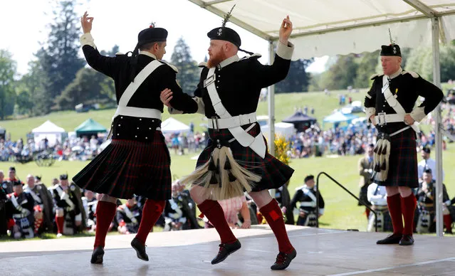 The Atholl Highlanders demonstrate a dance at the Atholl Gathering and Highland Games at Blair Castle, Scotland, Britain, May 27, 2018. (Photo by Russell Cheyne/Reuters)