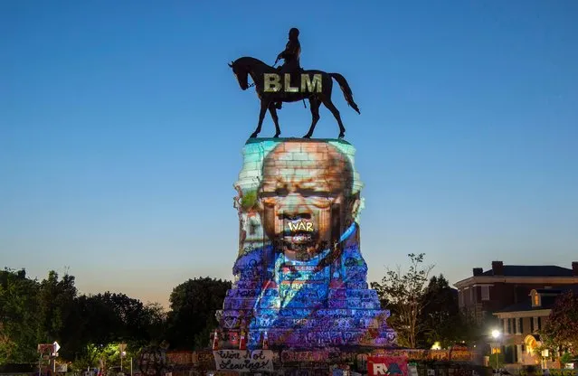 The image of late Rep. John Lewis, a pioneer of the civil rights movement and long-time member of the U.S. House of Representatives, is projected on the statue of Confederate General Robert E. Lee in Richmond, Virginia, U.S. July 19, 2020. (Photo by Jay Paul/Reuters)