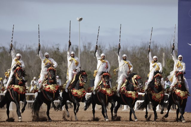 Moroccan horsemen perform during the 15th edition of the "Salon du Cheval" in the port city of El Jadida on October 4, 2024. (Photo by AFP Photo/Stringer)