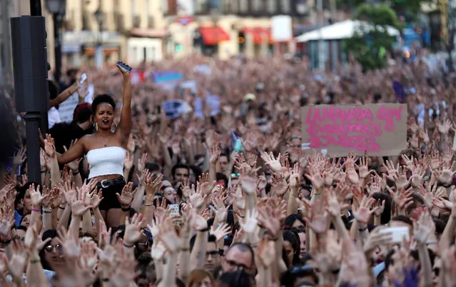 Protesters attend a demonstration against the release on bail of five men known as the “Wolf Pack” cleared of gang rape of a teenager and convicted of a lesser crime of sexual abuse in Madrid, Spain, June 22, 2018. (Photo by Susana Vera/Reuters)