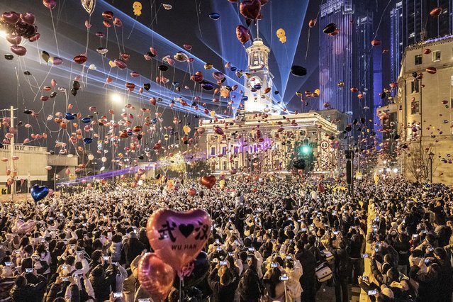People attend a New Year celebration in Wuhan, in China's central Hubei province on January 1, 2025. (Photo by AFP Photo/China Stringer Network)