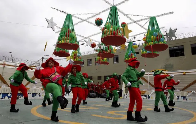 Inmates in costumes dance during a Christmas event at Sarita Colonia male prison in Callao, Peru, December 18, 2015. (Photo by Mariana Bazo/Reuters)